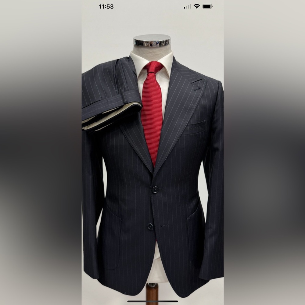 Navy pinstripe wool suit with patch pocket